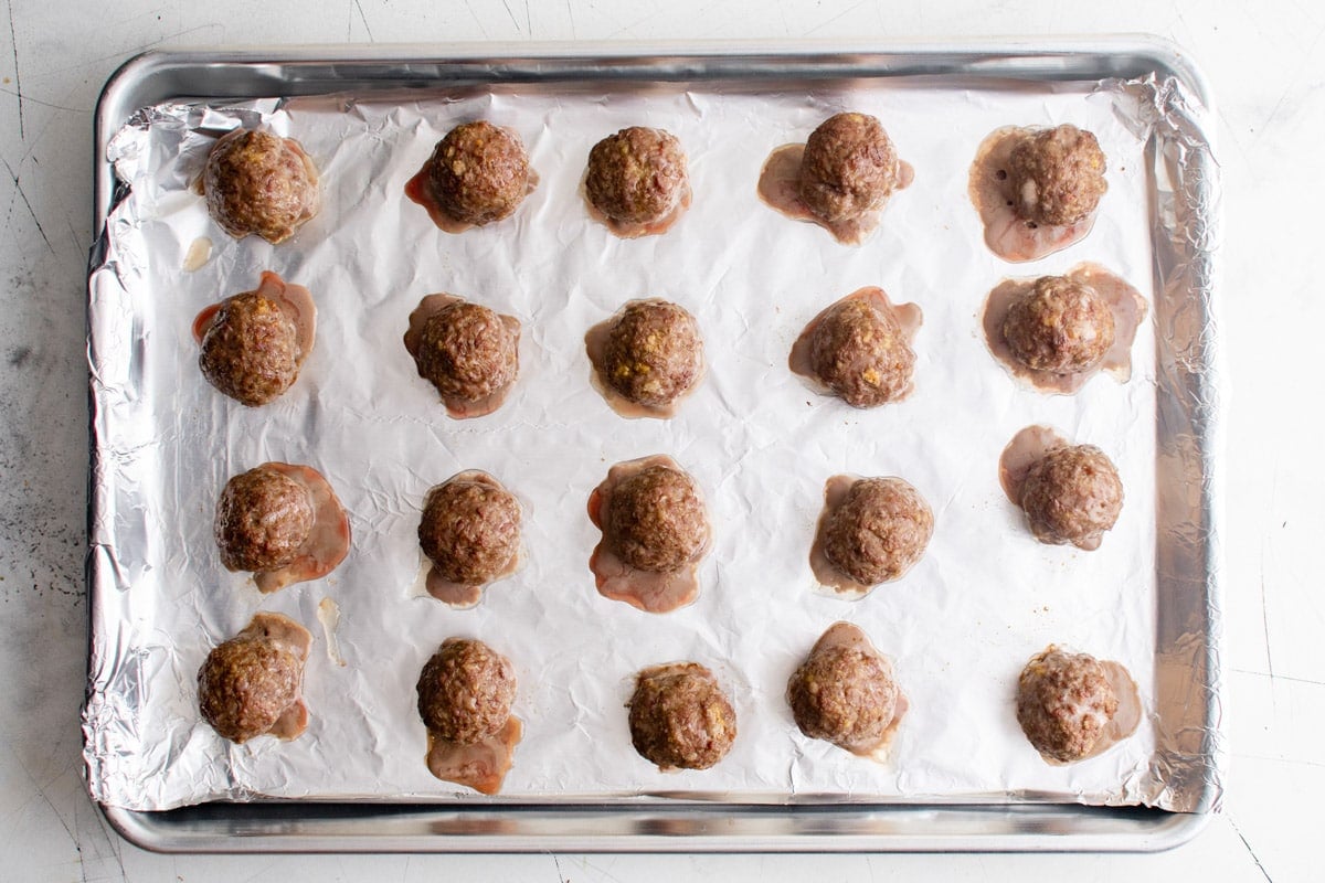 baked meatballs on a foil lined tray