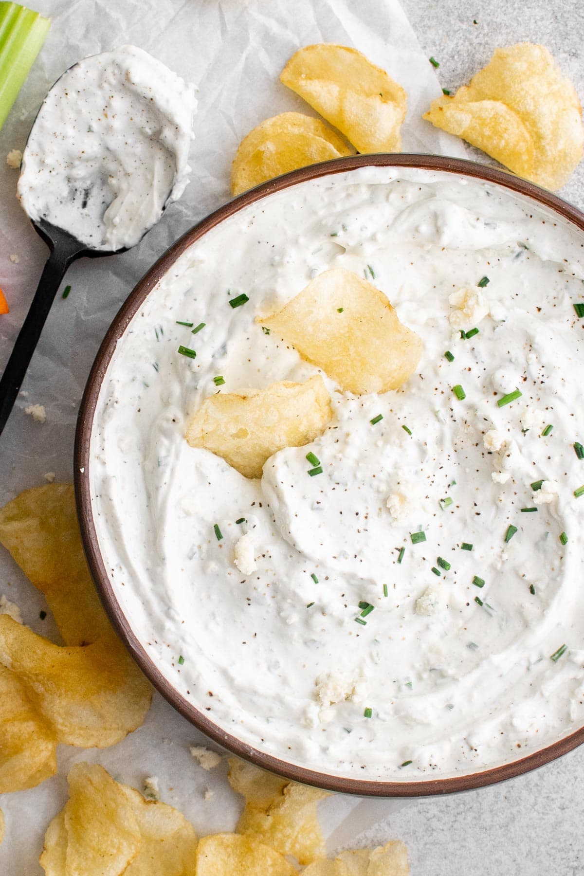blue cheese dip in a bowl with potato chips