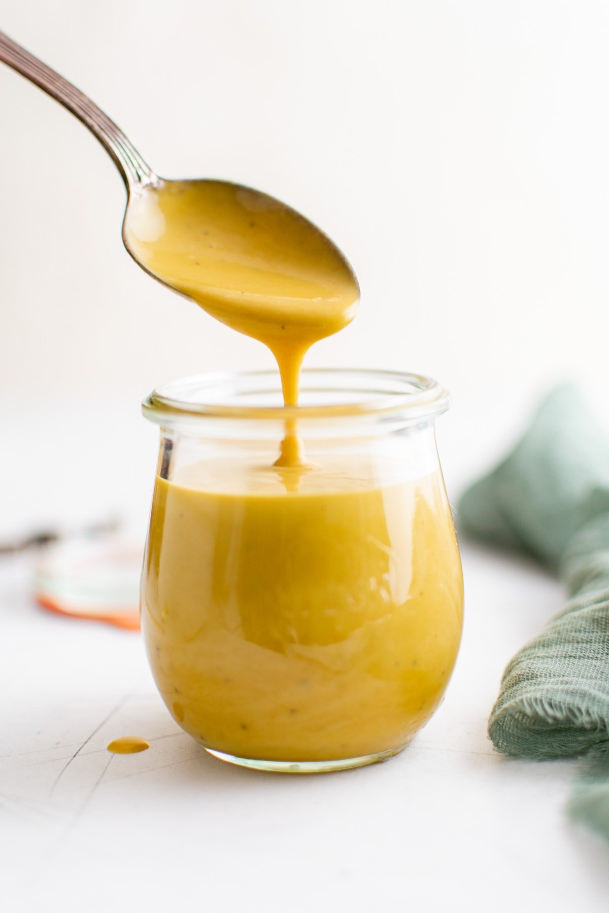 jar of honey mustard and a spoon