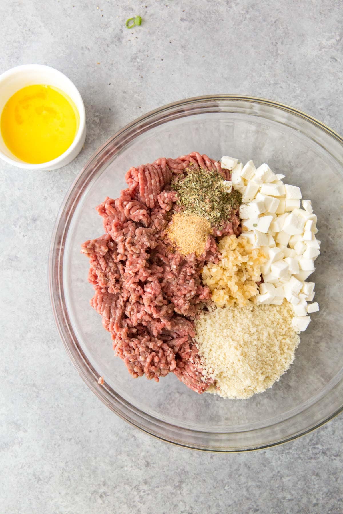 ground beef, egg, breadcrumbs and cheese in a large bowl