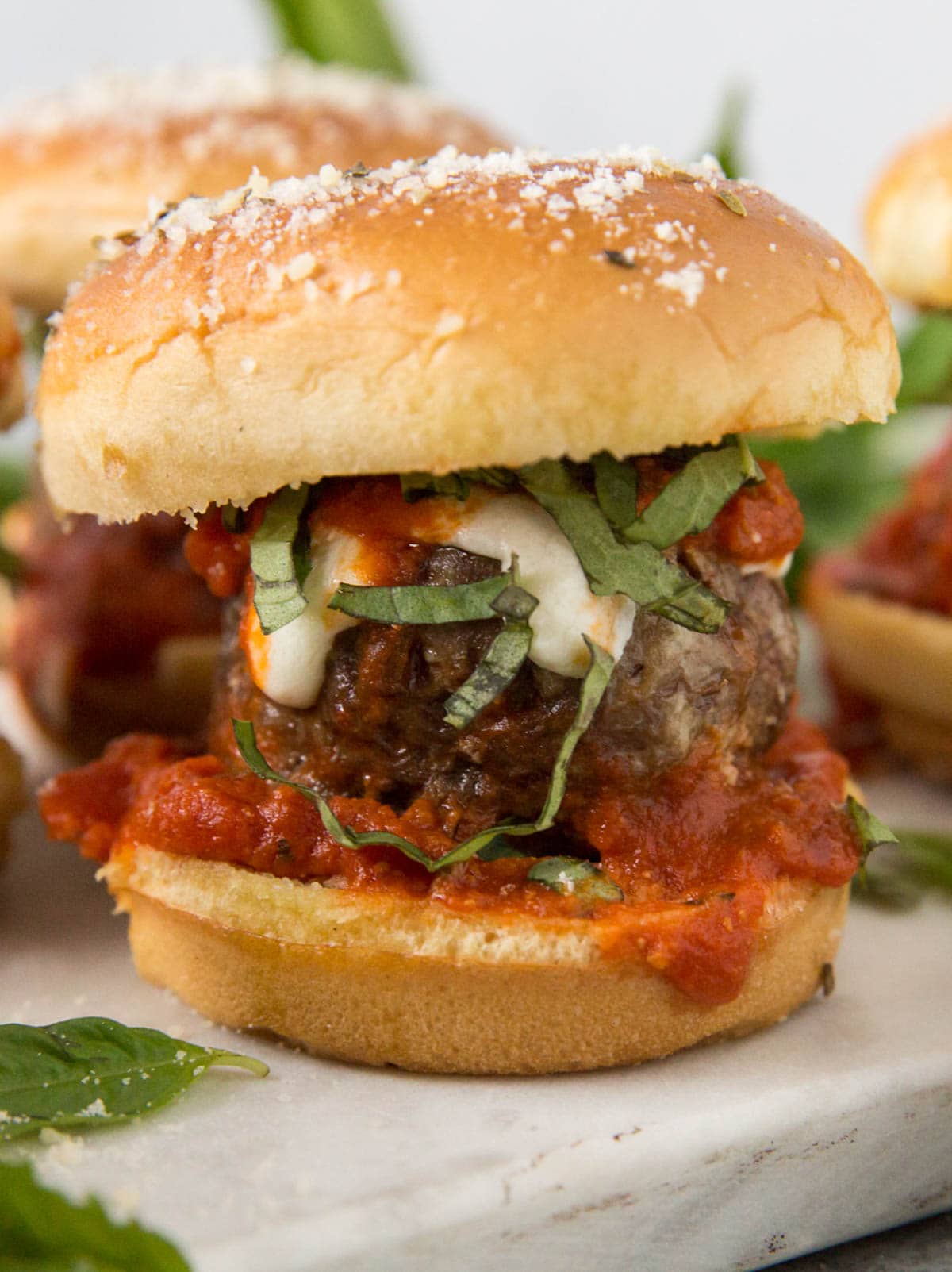 Italian meatball slider with cheese and fresh basil