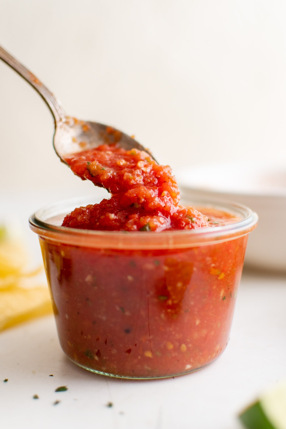 jar of salsa, spoon