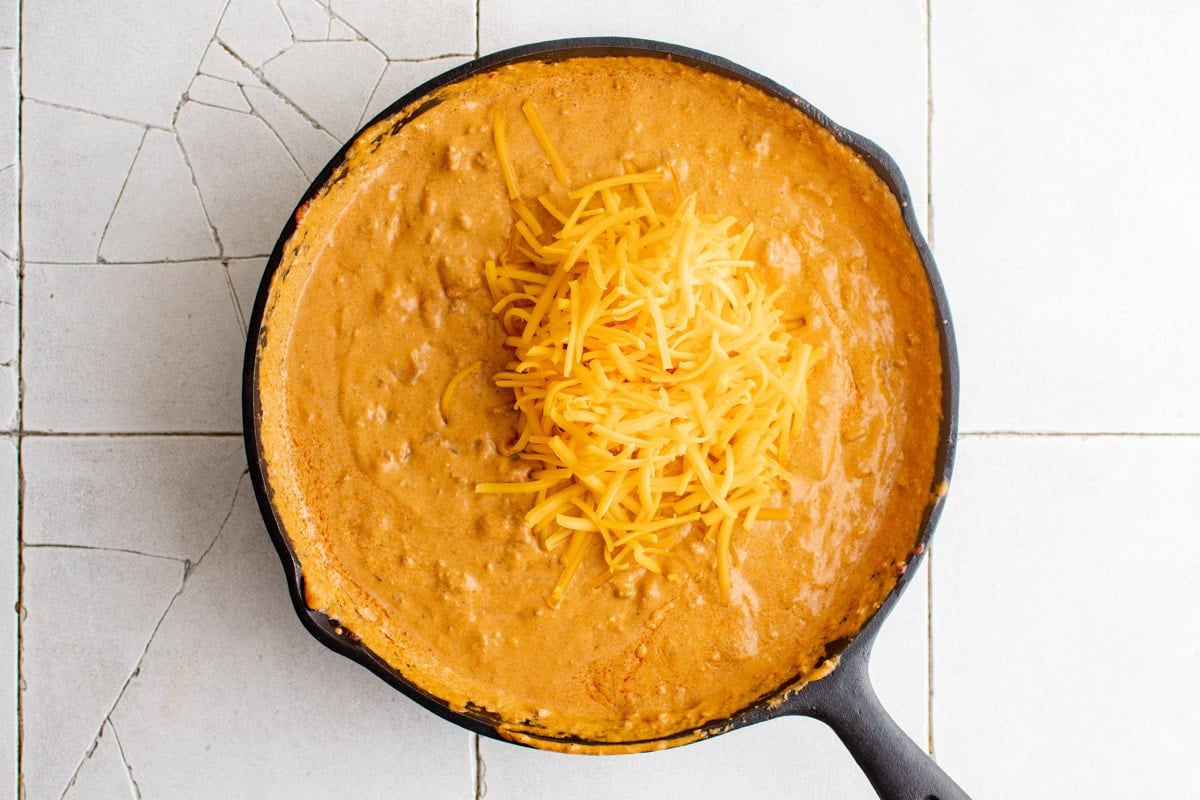 creamy sausage dip with shredded cheddar cheese