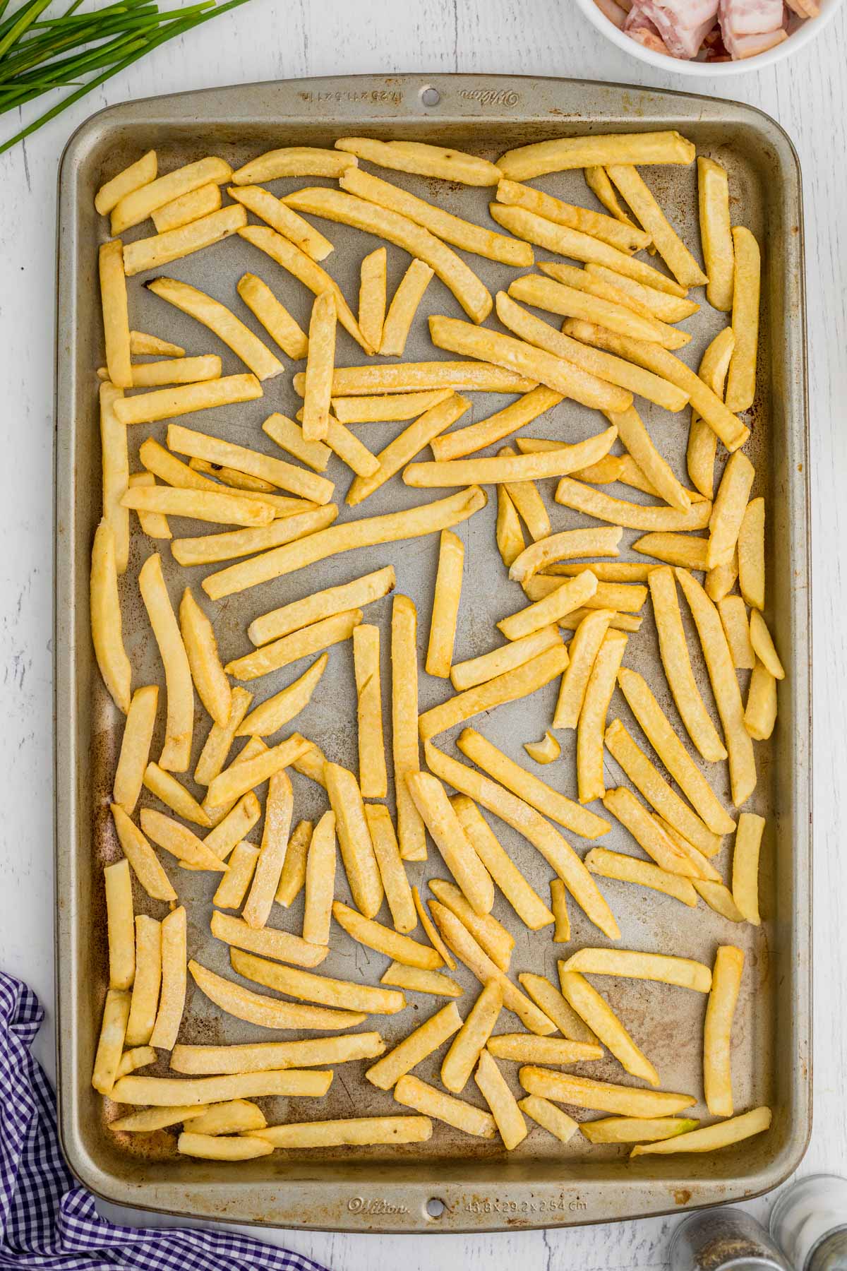 frozen fries on a baking sheet