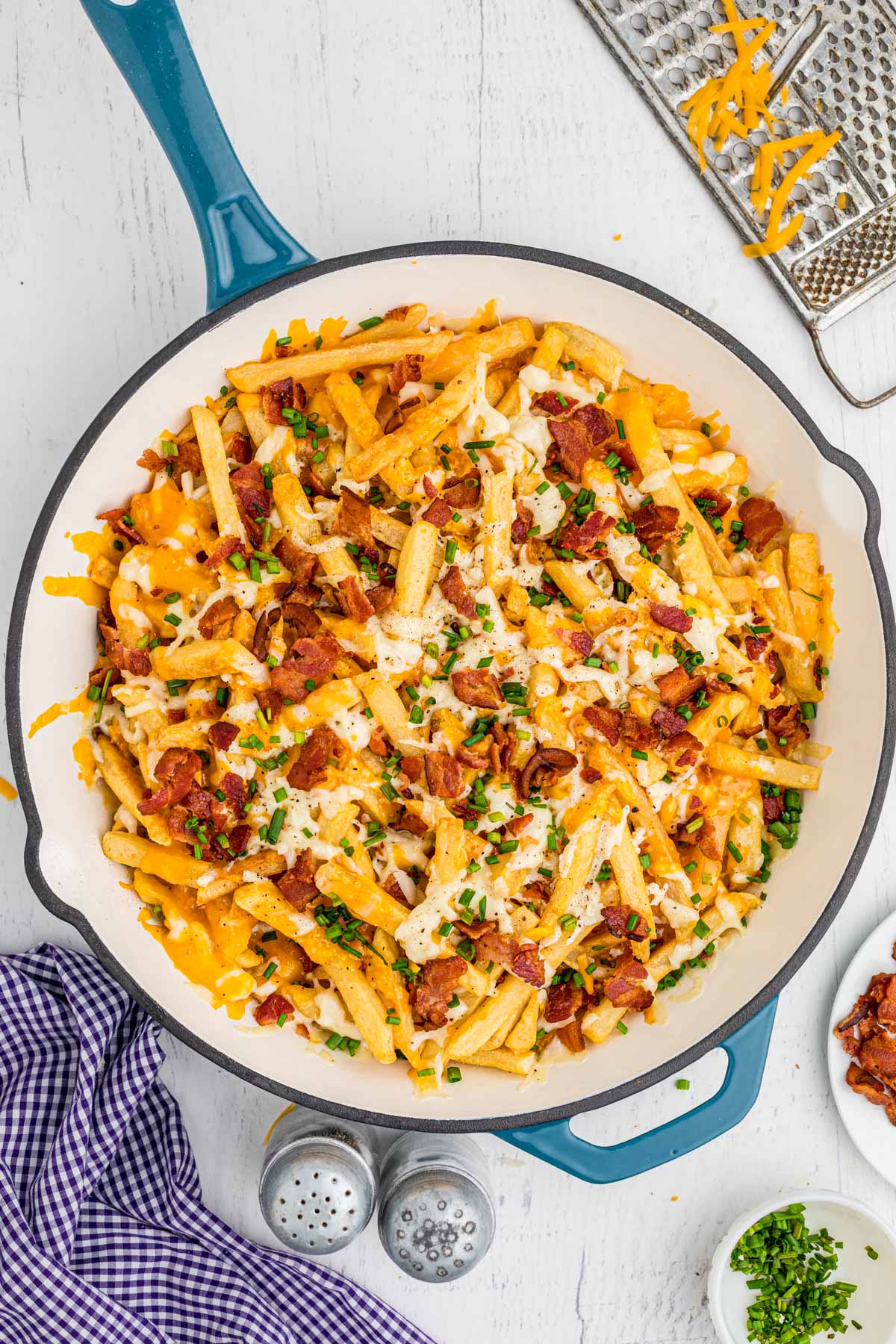 skillet with cheese fries with bacon and chives