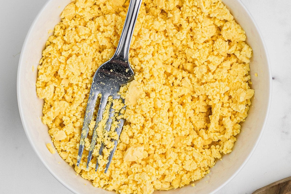 mashed hard eggs yolks with a fork