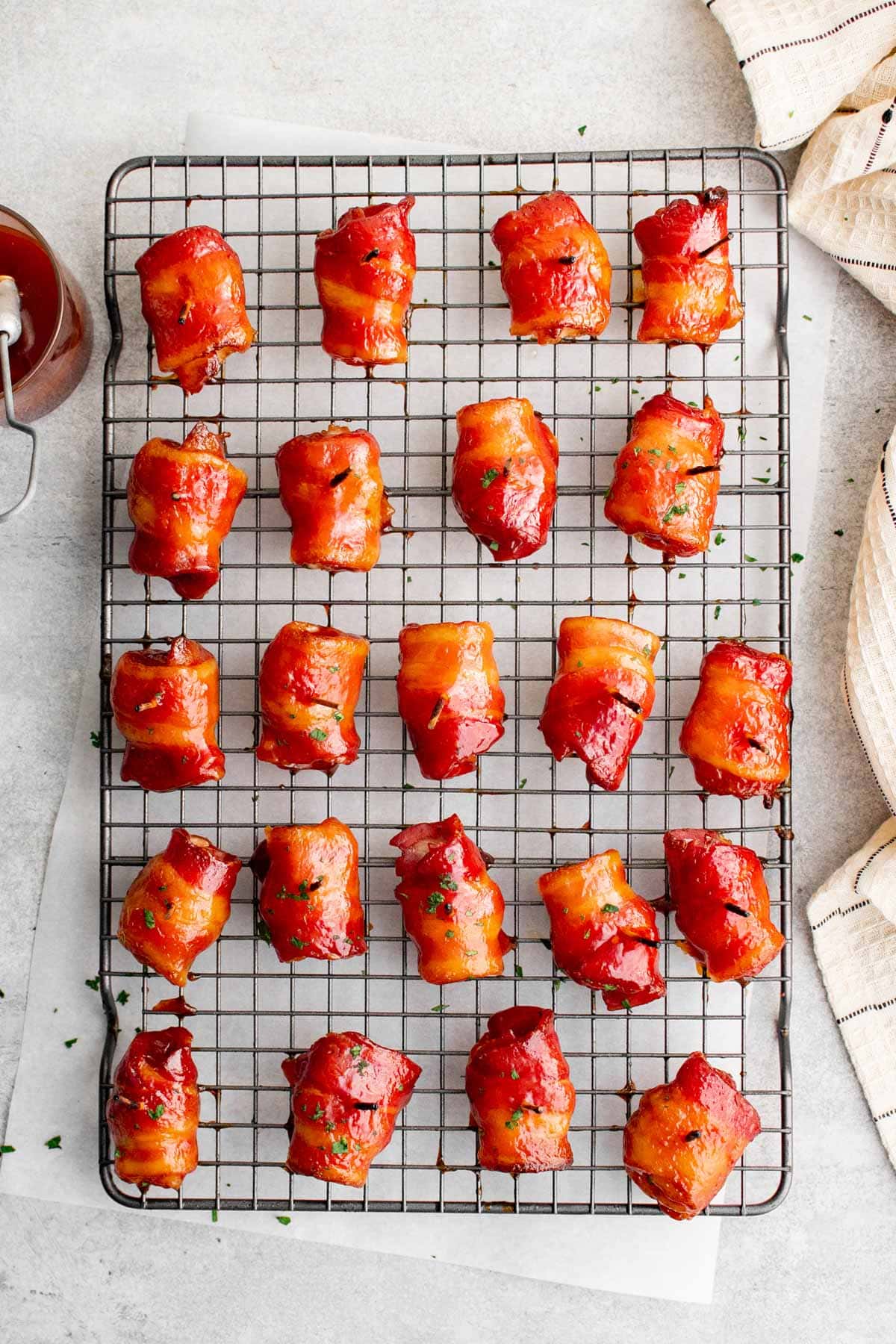 bacon wrapped water chestnuts on a baking rack