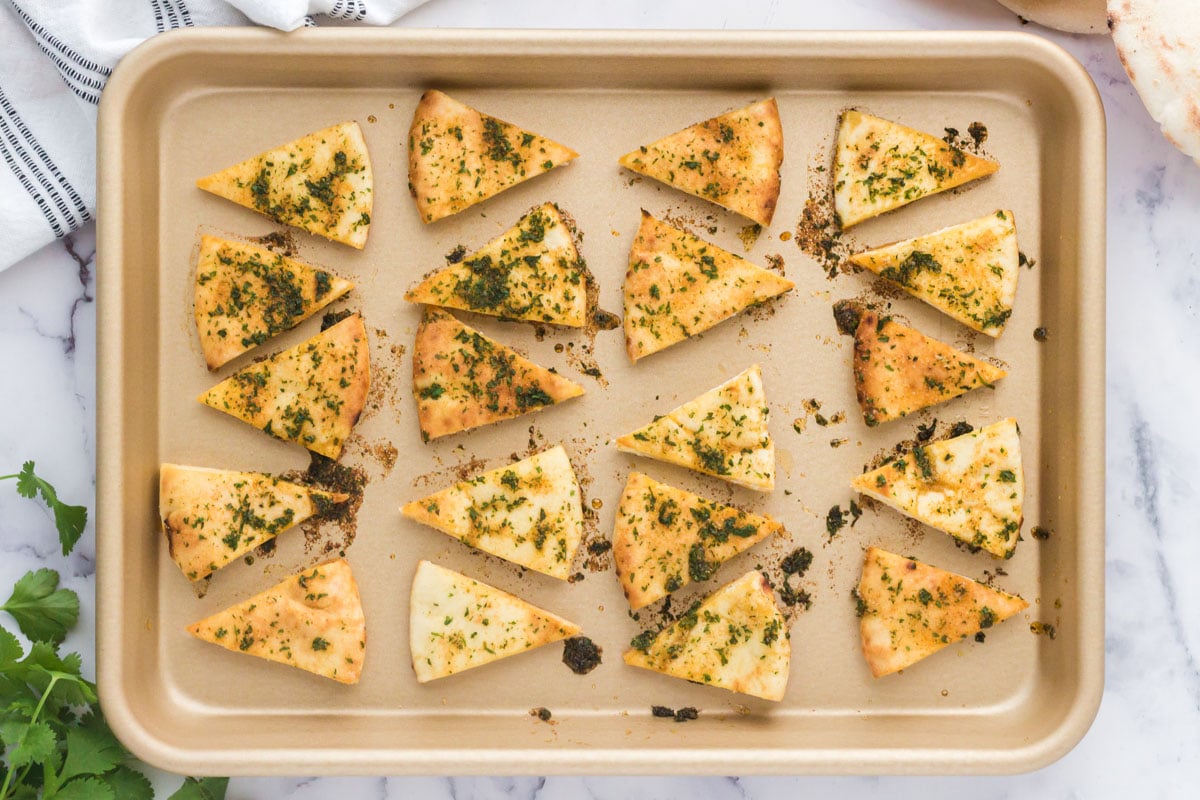 baked pita chips on a baking sheet