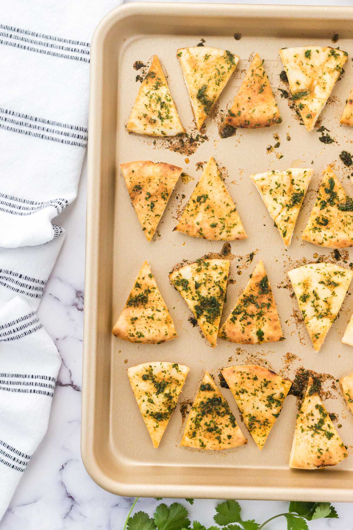 baked pita chips on a baking sheet