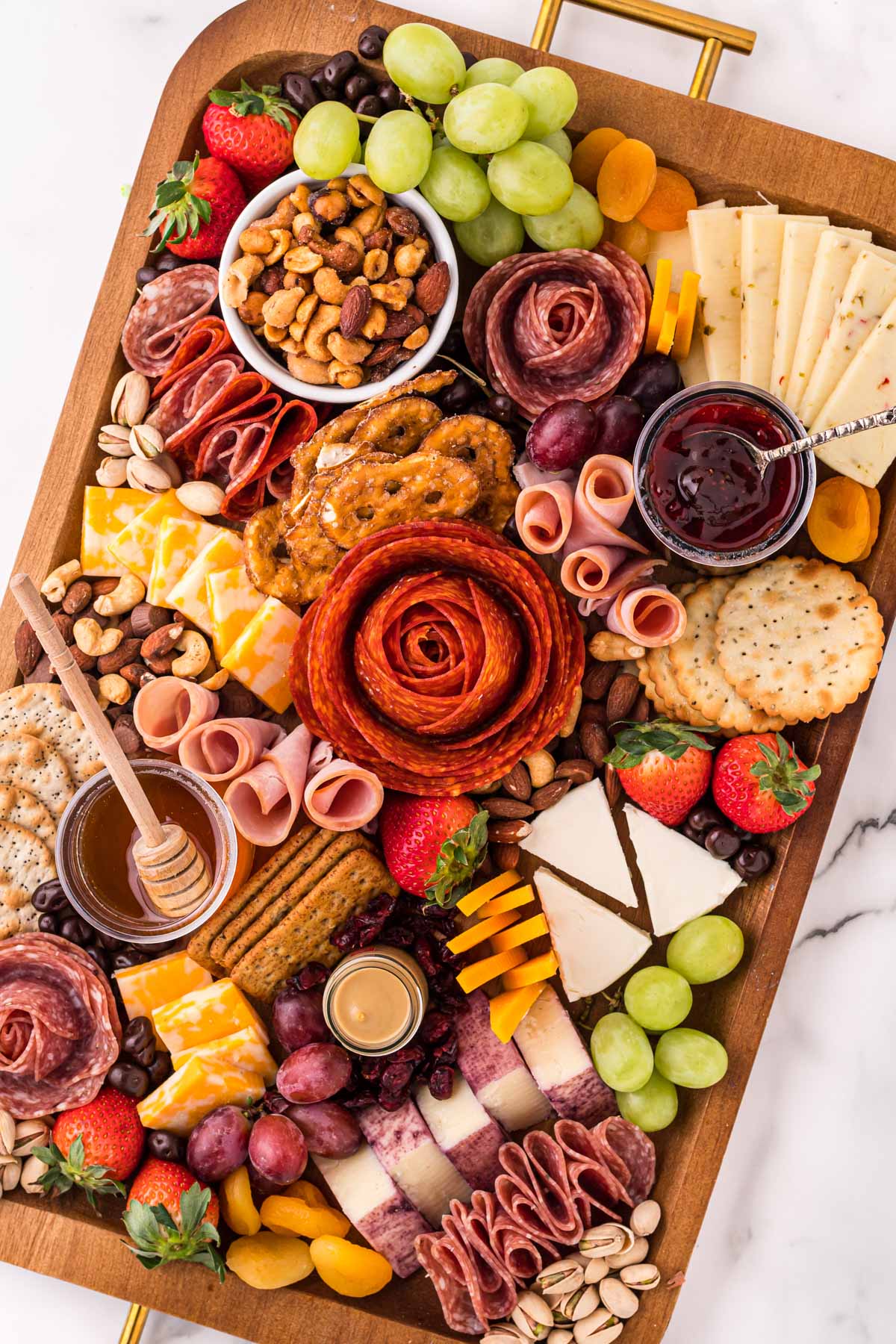 charcuterie board with meat, cheese and fruit