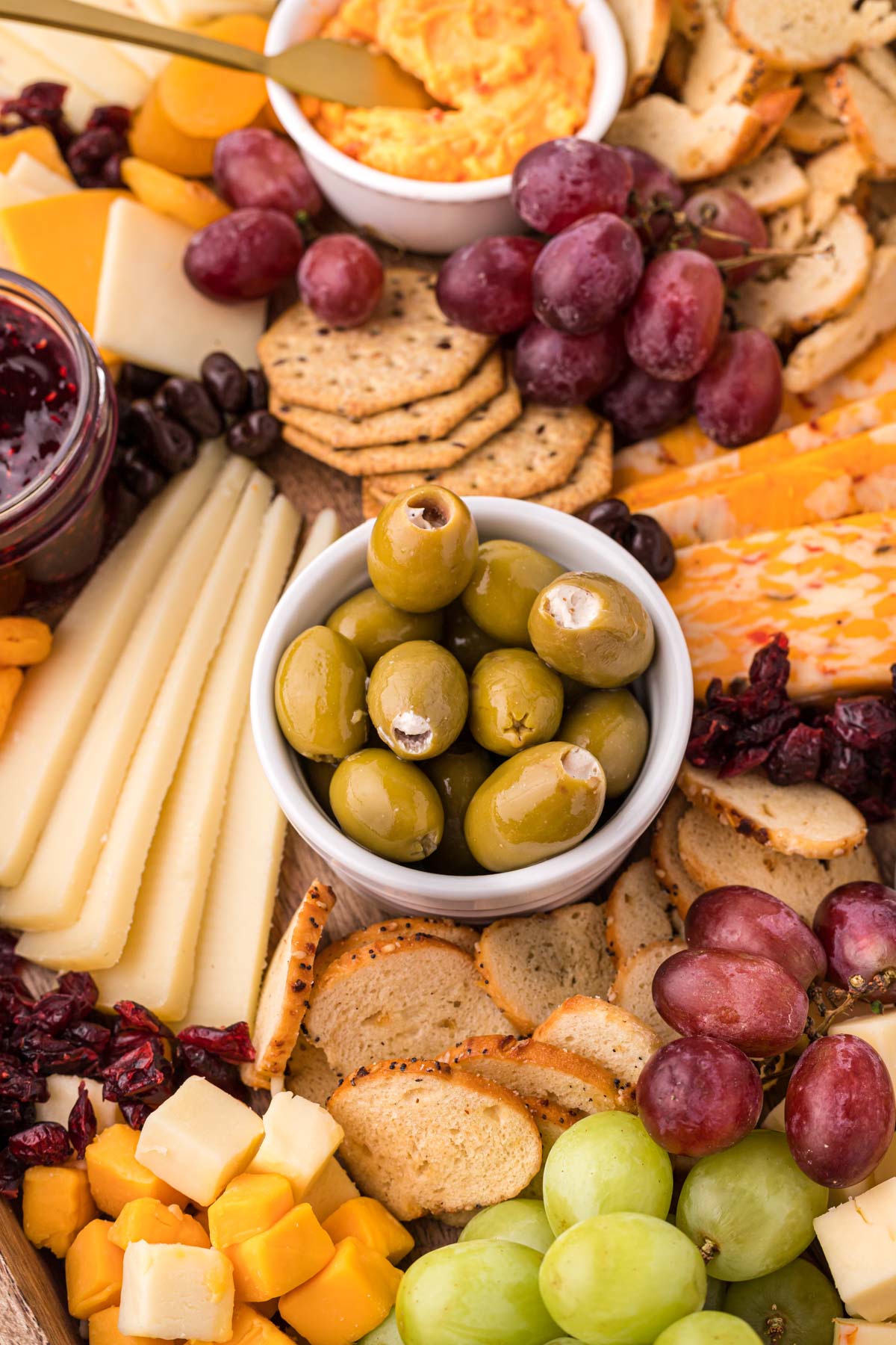 close up of cheese board showing stuffed olives