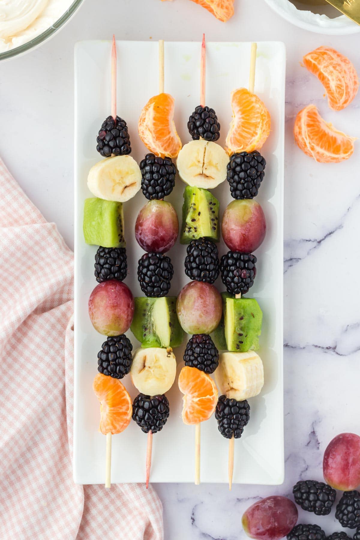 fruit kabobs on a platter