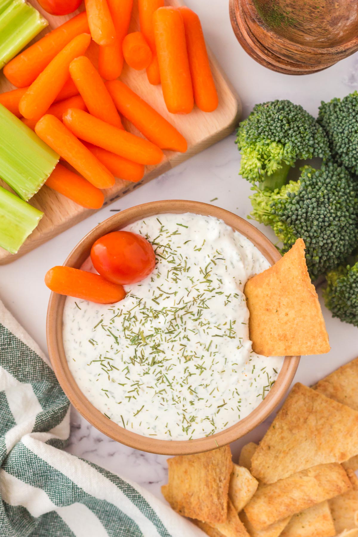 veggie dip with carrots, celery and tomatoes adn crackers