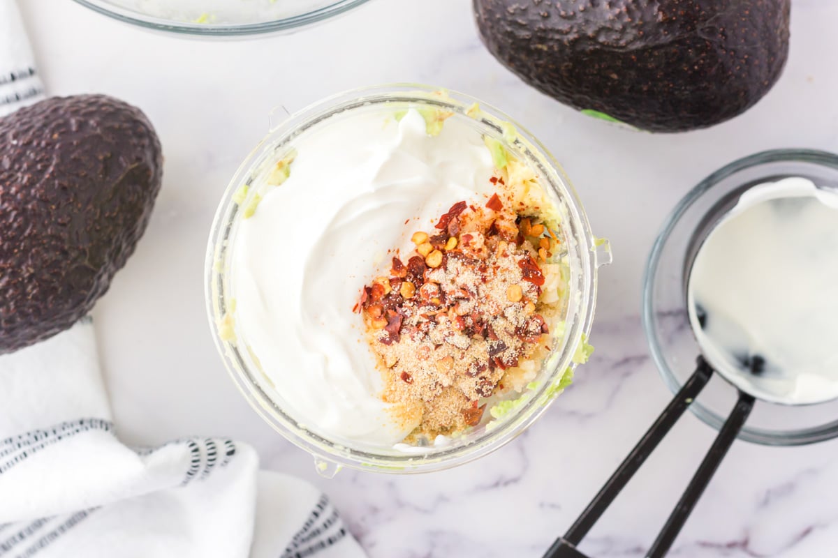 sour cream, avocado and spices in a bowl