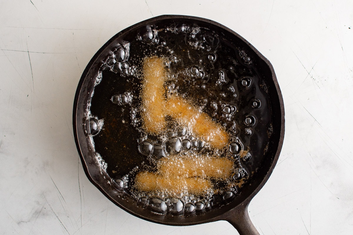 frying mozzarella sticks in hot oil