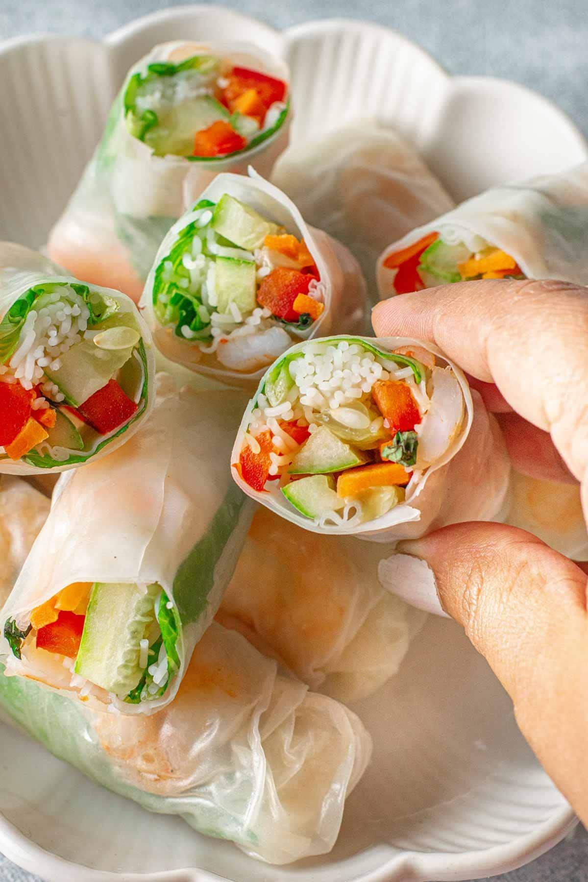 Spring Rolls cut open to reveal the shrimp and veggies inside.