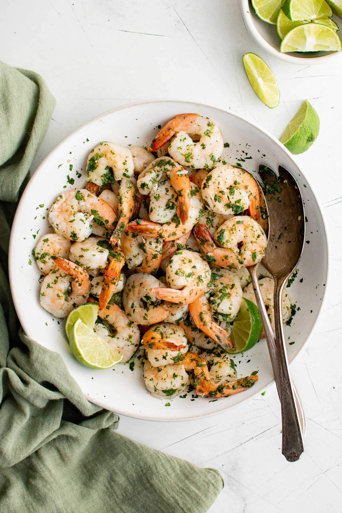 Cilantro Lime Shrimp and a metal spoon in a large white bowl. 