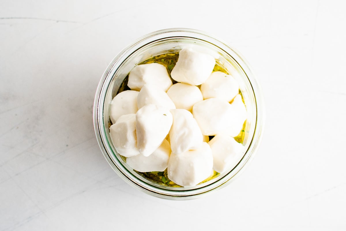 Mozzarella balls in a jar.