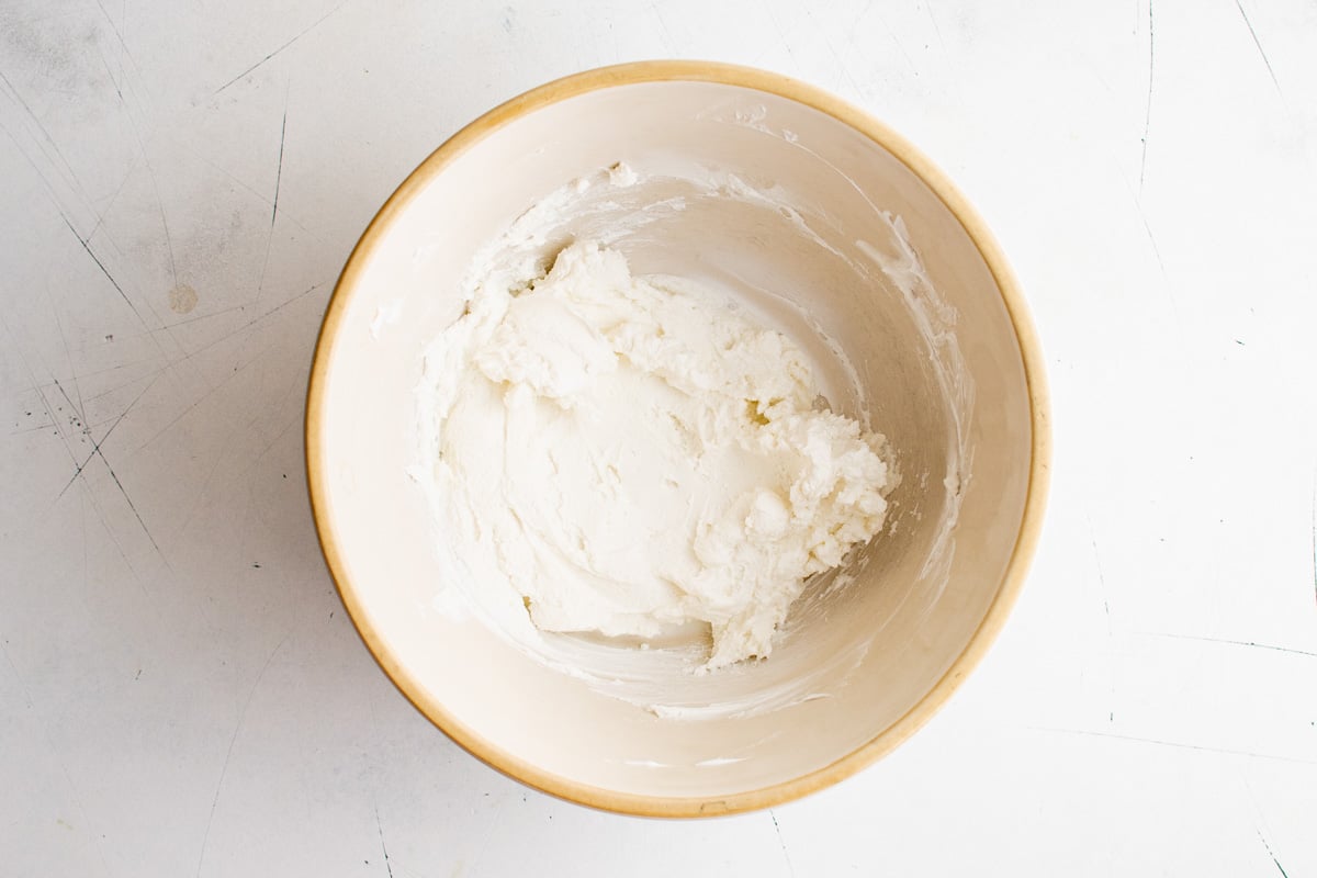 Goat cheese and yogurt blended in a bowl.